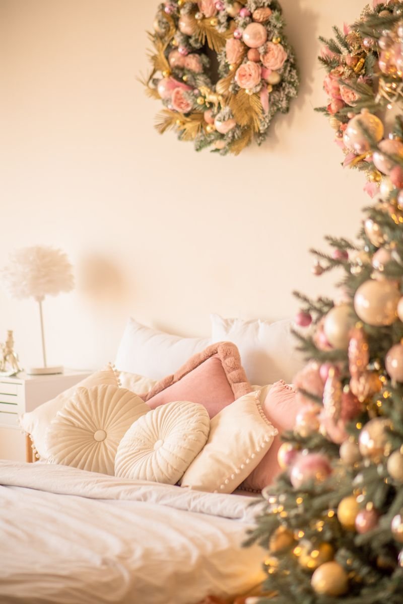 ornaments and garlands paired with soft hints of pink in flowers, bows, and accents